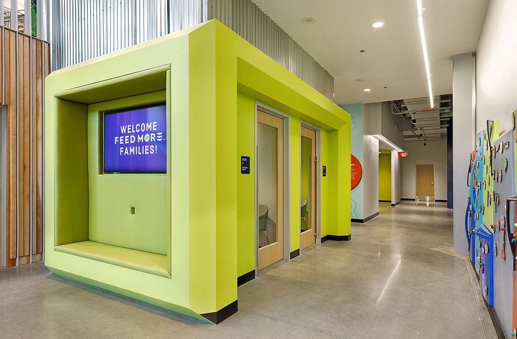 Brightly colored and decorated lobby for Feed More