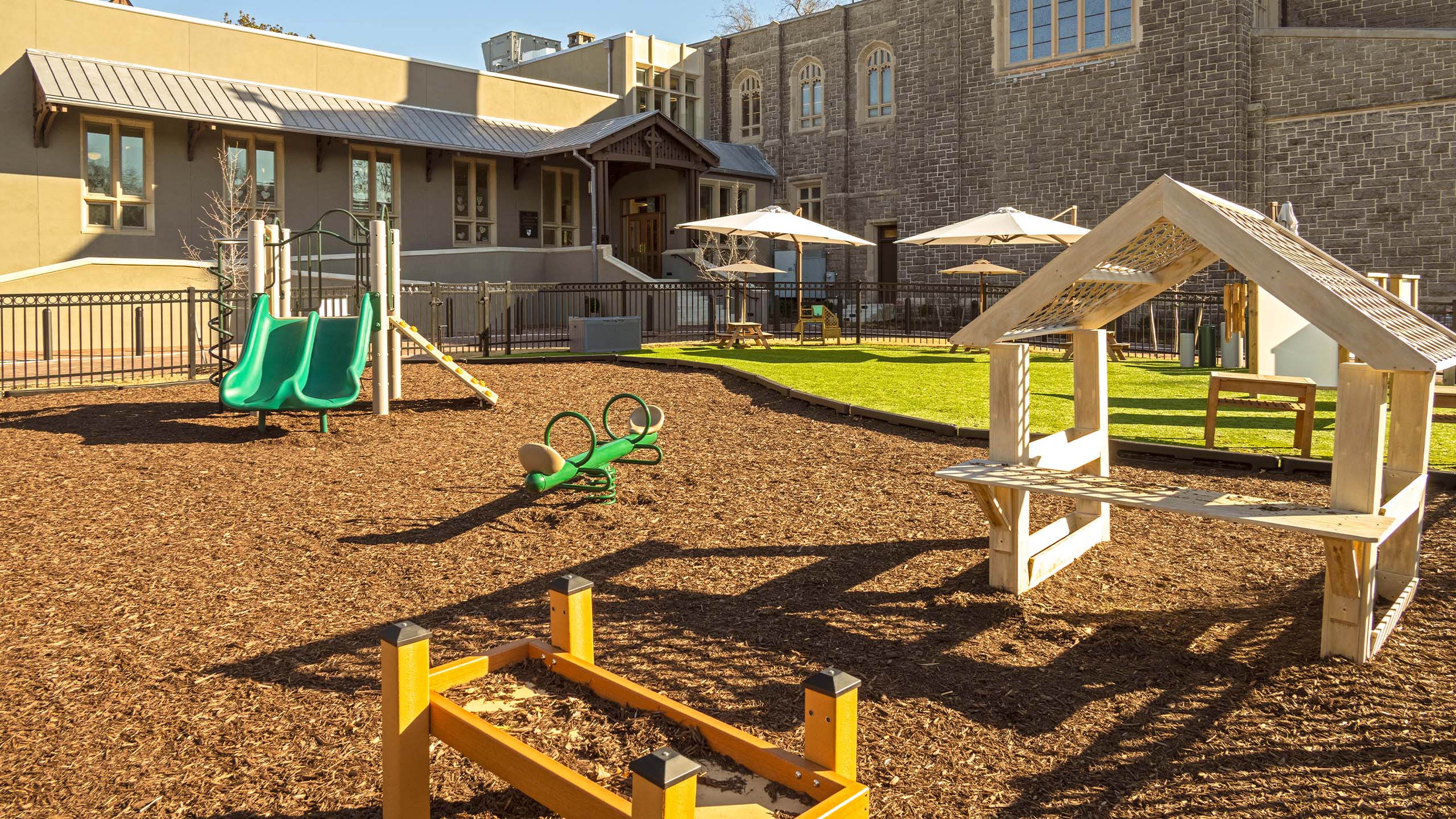 Church playground with wooden play pieces